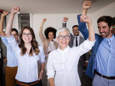 happy-business-people-celebrating-success-at-compa-5FUVHK4.jpg